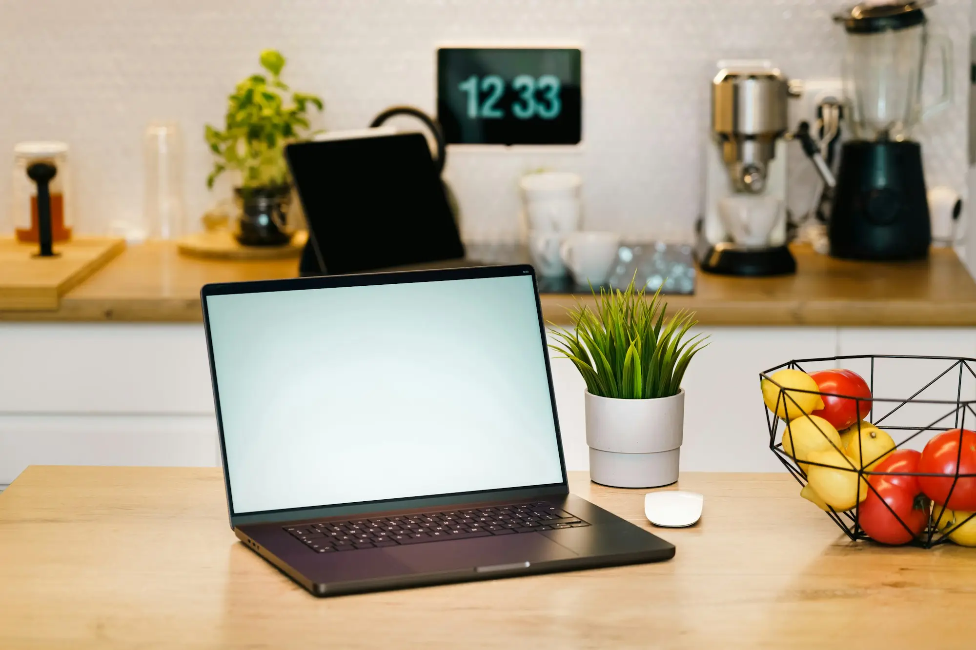 Laptop on a kitchen bench ready for working out numbers