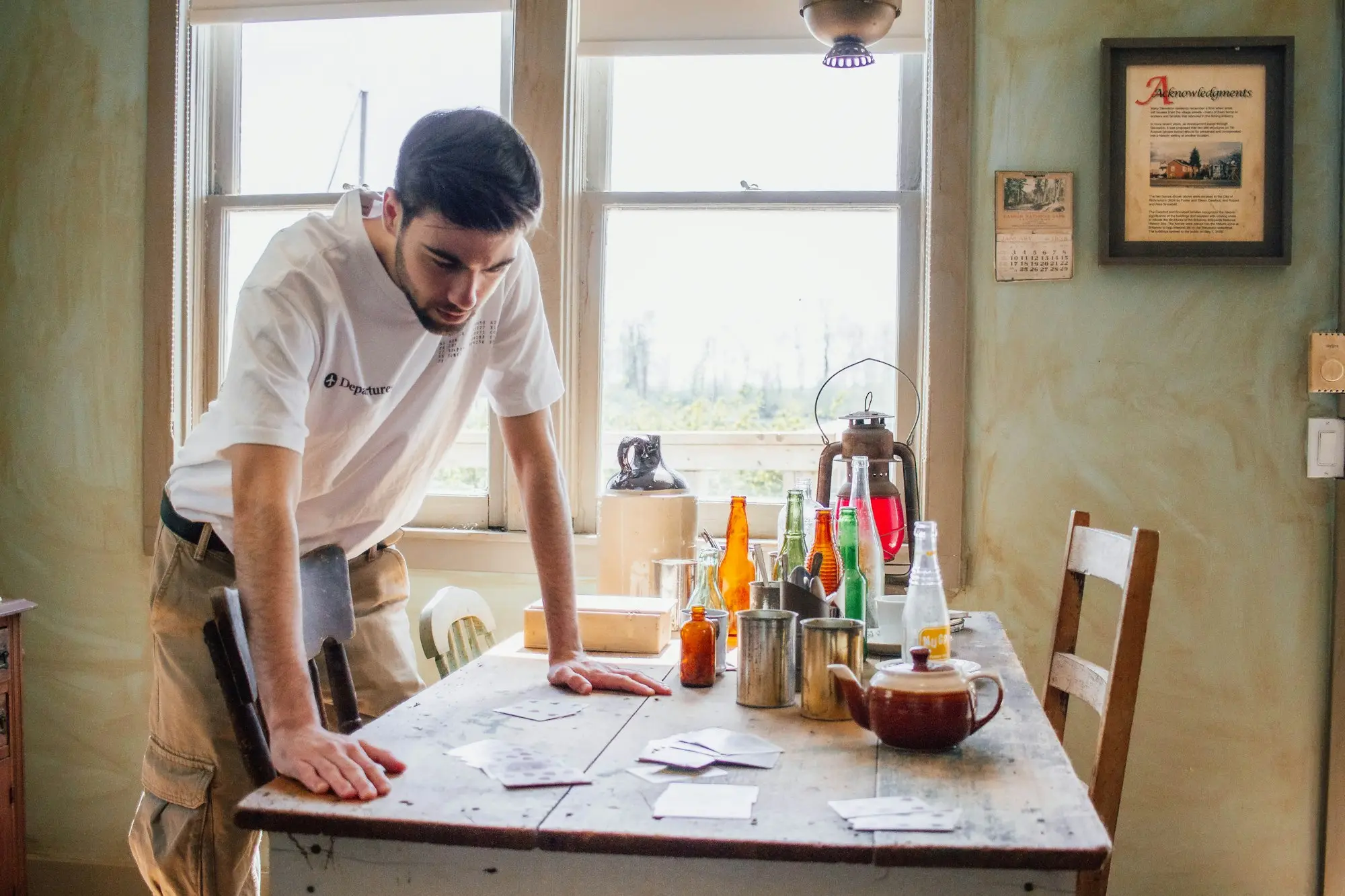 Business owner reading a loan statement at the kitchen table